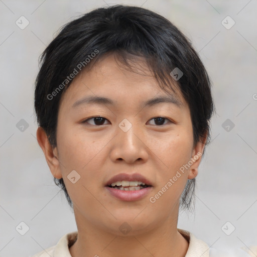 Joyful asian young-adult female with short  brown hair and brown eyes