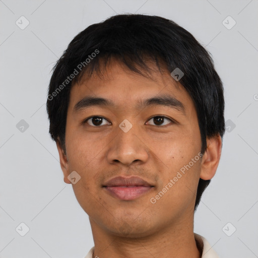 Joyful latino adult male with short  black hair and brown eyes