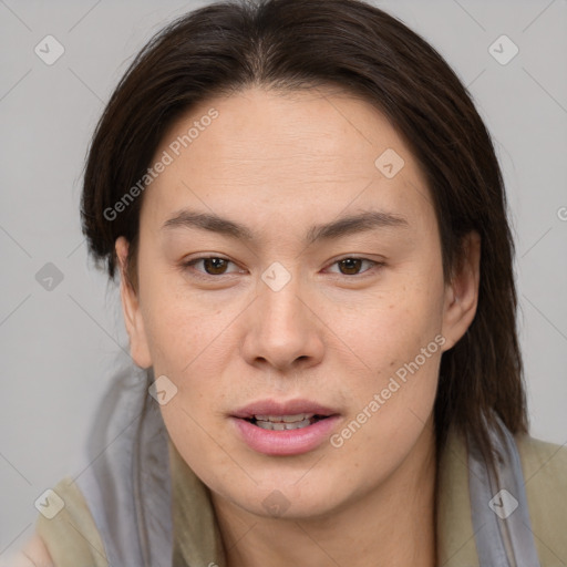 Joyful asian young-adult female with medium  brown hair and brown eyes