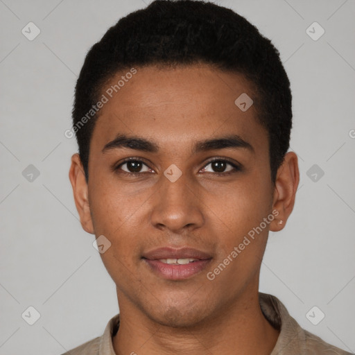 Joyful black young-adult male with short  black hair and brown eyes