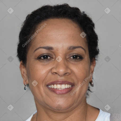 Joyful black adult female with short  brown hair and brown eyes