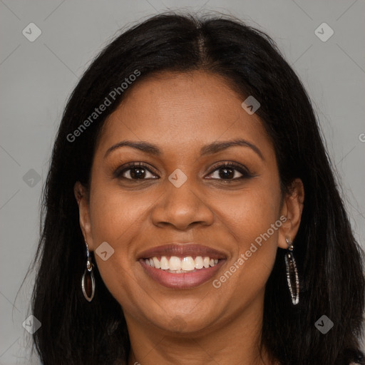 Joyful black young-adult female with long  brown hair and brown eyes