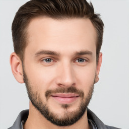 Joyful white young-adult male with short  brown hair and brown eyes