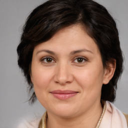 Joyful white adult female with medium  brown hair and brown eyes