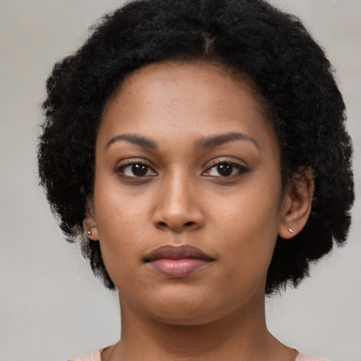 Neutral black young-adult female with short  black hair and brown eyes