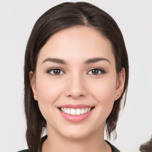 Joyful white young-adult female with medium  brown hair and brown eyes