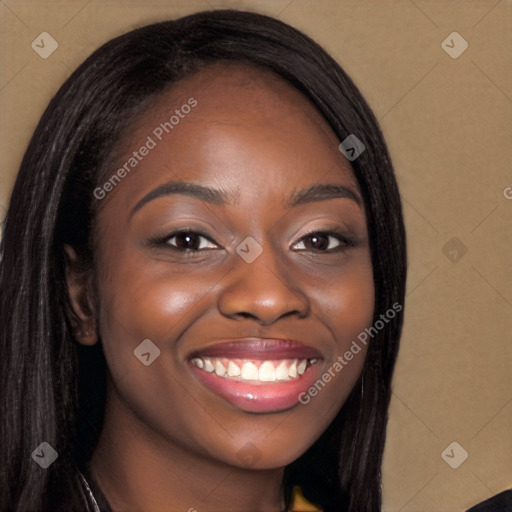 Joyful black young-adult female with long  brown hair and brown eyes