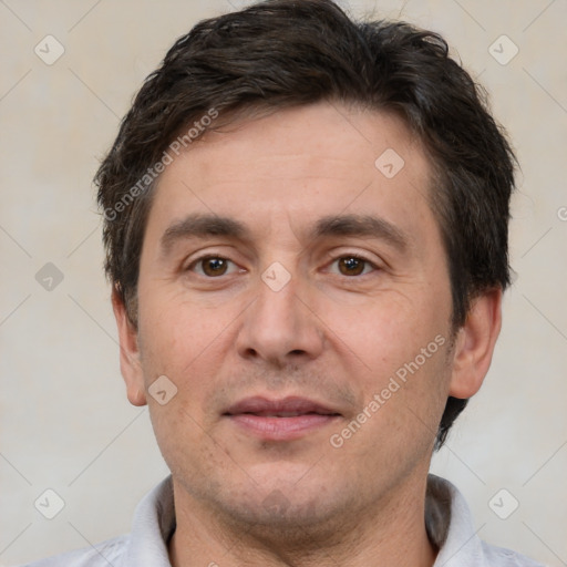 Joyful white adult male with short  brown hair and brown eyes