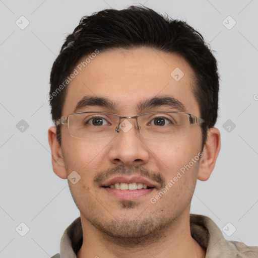 Joyful white young-adult male with short  black hair and brown eyes