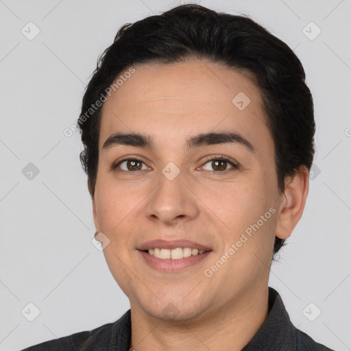 Joyful white young-adult male with short  black hair and brown eyes