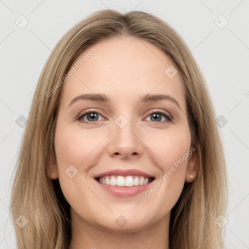 Joyful white young-adult female with long  brown hair and grey eyes