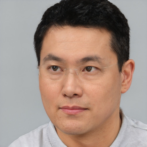 Neutral white adult male with short  black hair and brown eyes