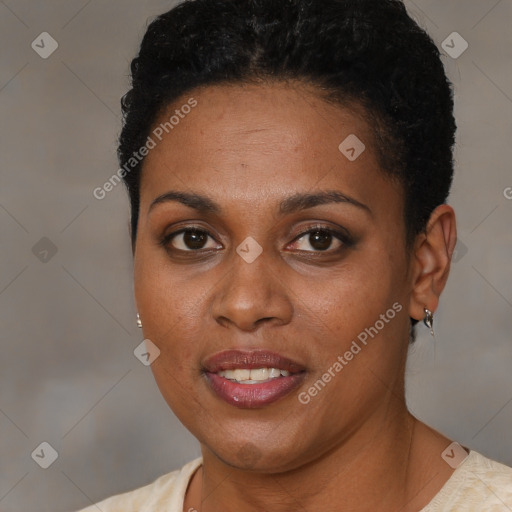 Joyful black young-adult female with short  brown hair and brown eyes