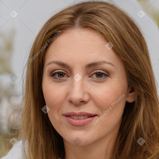 Joyful white adult female with long  brown hair and brown eyes