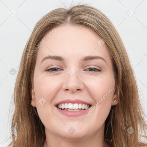 Joyful white young-adult female with long  brown hair and grey eyes