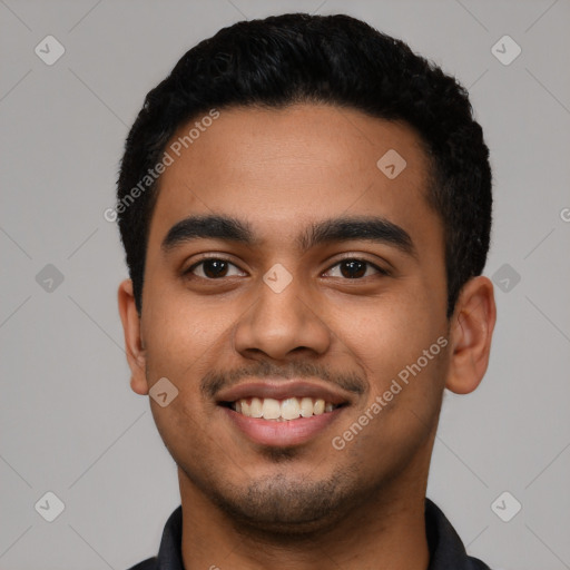 Joyful latino young-adult male with short  black hair and brown eyes