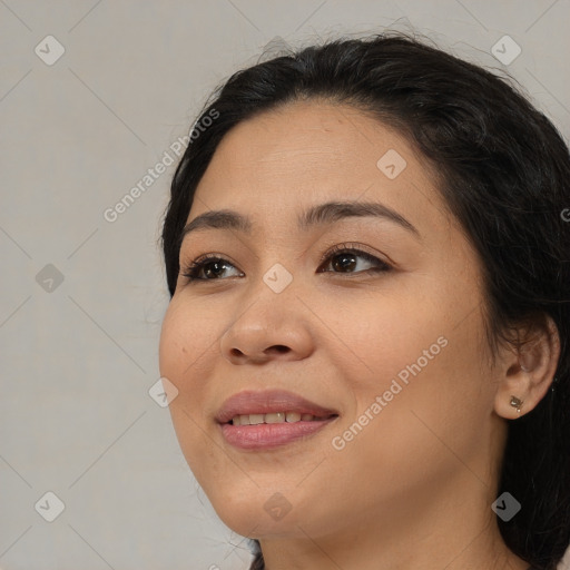 Joyful asian young-adult female with medium  black hair and brown eyes