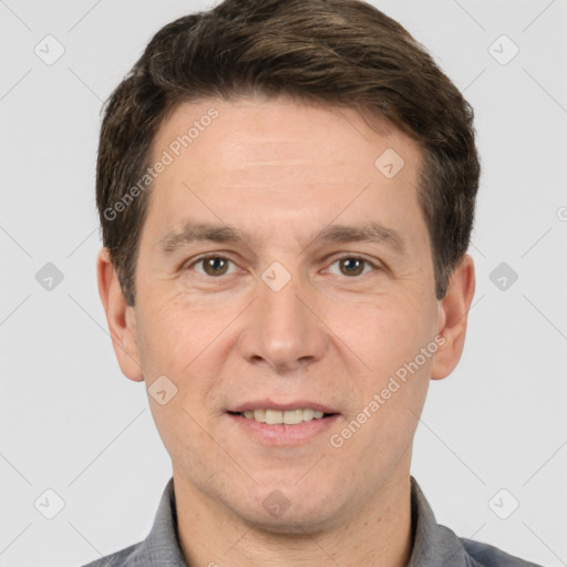 Joyful white adult male with short  brown hair and brown eyes