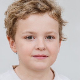 Joyful white child female with short  brown hair and brown eyes