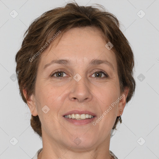 Joyful white adult female with short  brown hair and grey eyes