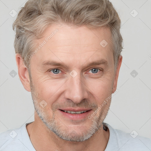 Joyful white adult male with short  brown hair and grey eyes