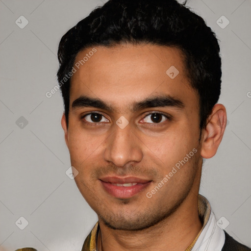 Joyful latino young-adult male with short  black hair and brown eyes