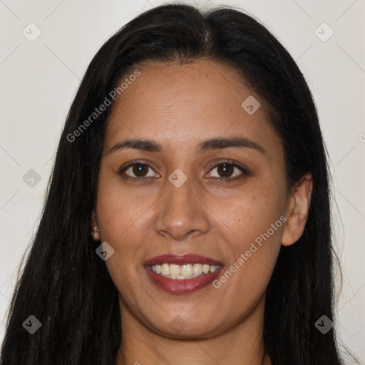 Joyful latino young-adult female with long  black hair and brown eyes