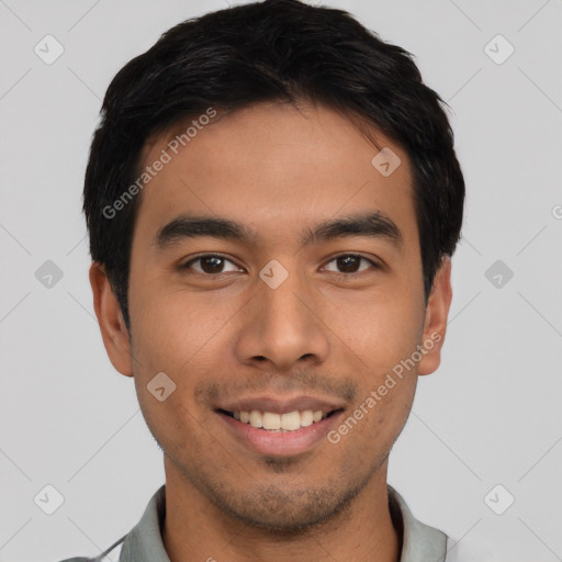 Joyful asian young-adult male with short  brown hair and brown eyes