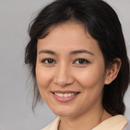 Joyful asian young-adult female with medium  brown hair and brown eyes