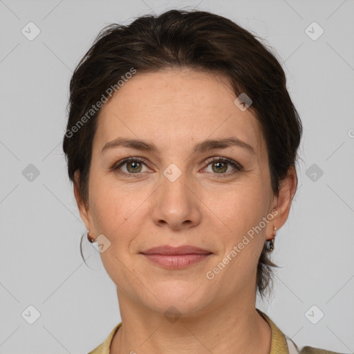 Joyful white adult female with short  brown hair and grey eyes