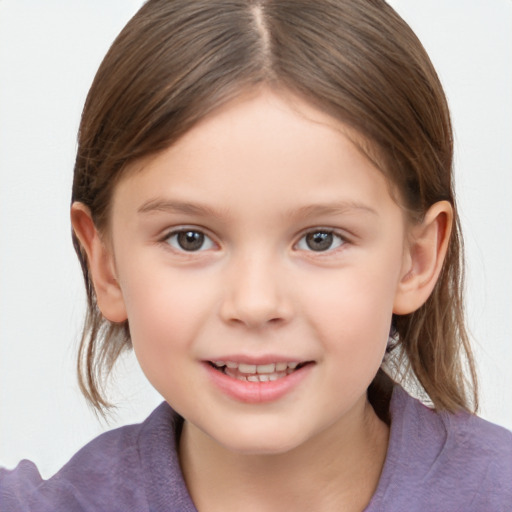 Joyful white child female with medium  brown hair and brown eyes