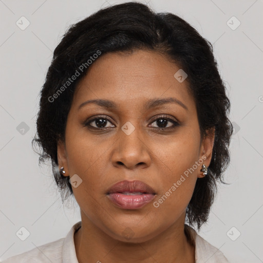 Joyful black young-adult female with medium  brown hair and brown eyes