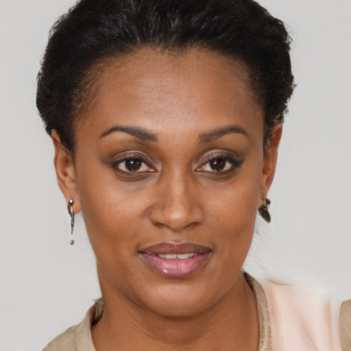 Joyful black young-adult female with short  brown hair and brown eyes