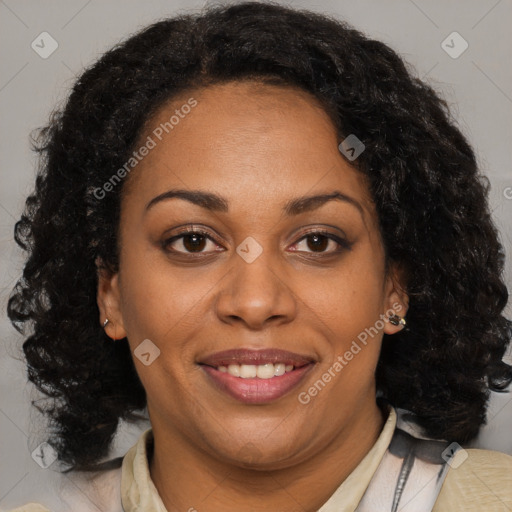 Joyful black adult female with medium  brown hair and brown eyes