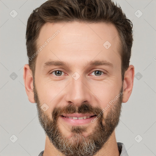 Joyful white adult male with short  brown hair and brown eyes