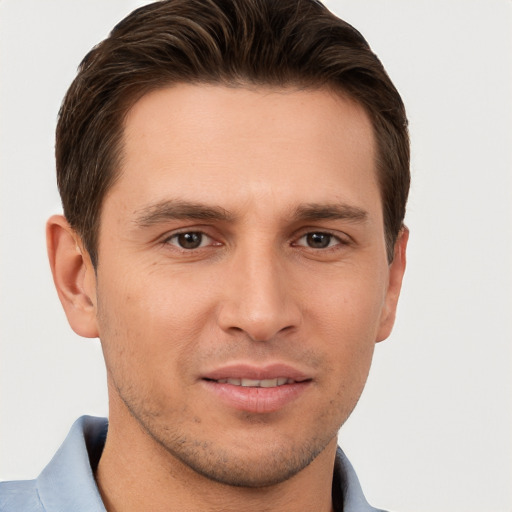 Joyful white young-adult male with short  brown hair and brown eyes