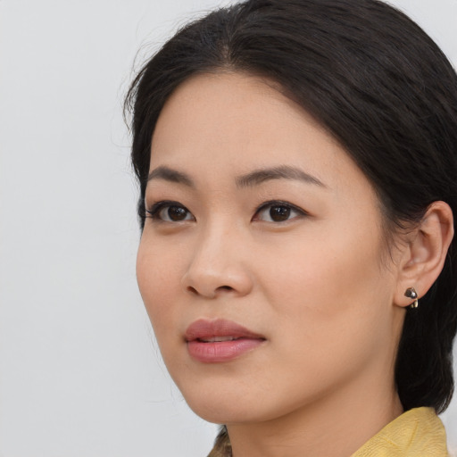 Neutral asian young-adult female with medium  black hair and brown eyes