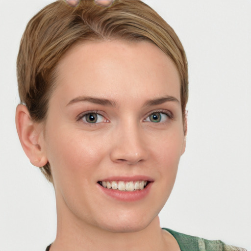 Joyful white young-adult female with short  brown hair and grey eyes