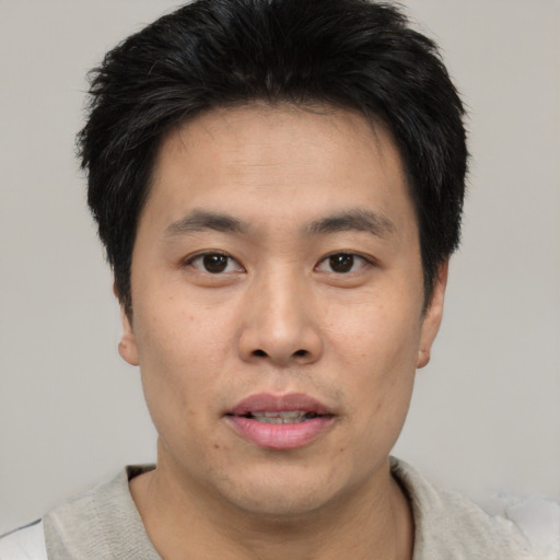 Neutral asian young-adult male with short  black hair and brown eyes
