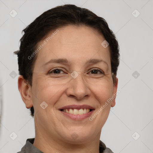 Joyful white adult female with short  brown hair and brown eyes