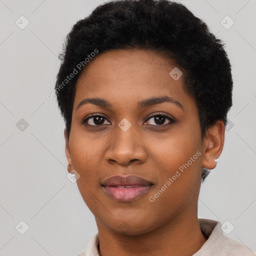 Joyful black young-adult female with short  black hair and brown eyes