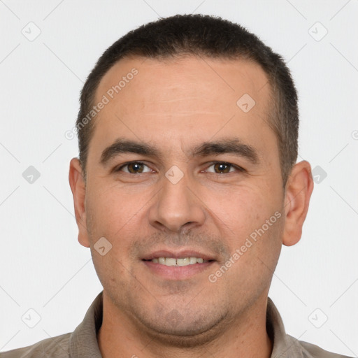 Joyful white young-adult male with short  brown hair and brown eyes