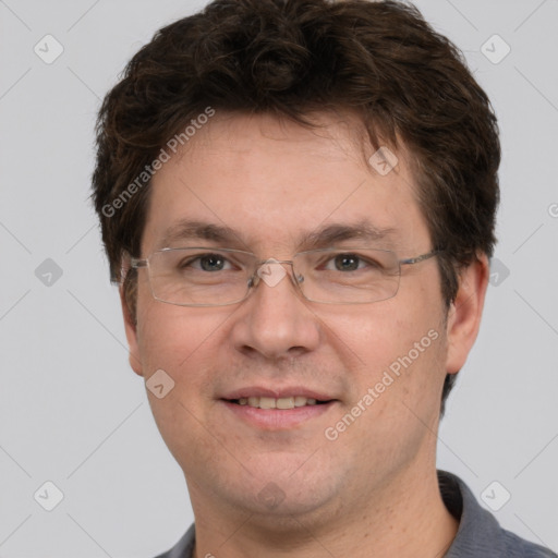 Joyful white adult male with short  brown hair and grey eyes