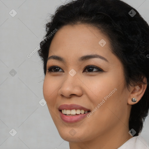 Joyful latino young-adult female with long  brown hair and brown eyes