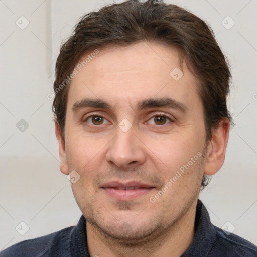 Joyful white adult male with short  brown hair and brown eyes