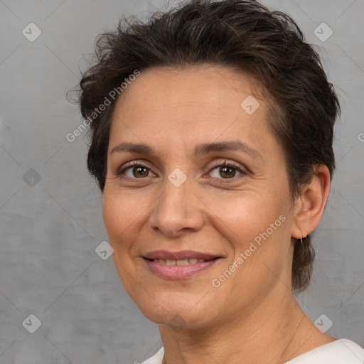 Joyful white adult female with short  brown hair and brown eyes