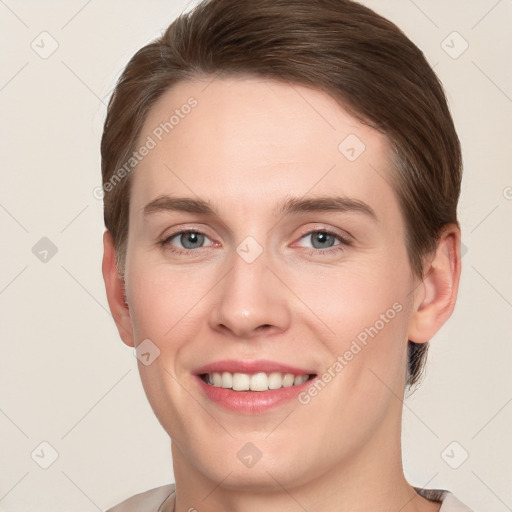 Joyful white young-adult female with short  brown hair and grey eyes