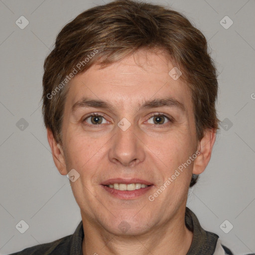 Joyful white adult male with short  brown hair and brown eyes