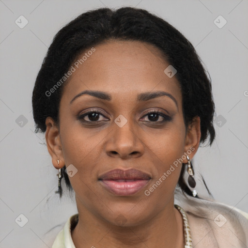 Joyful black adult female with short  brown hair and brown eyes