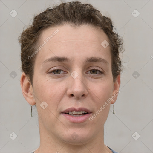 Joyful white adult female with short  brown hair and grey eyes